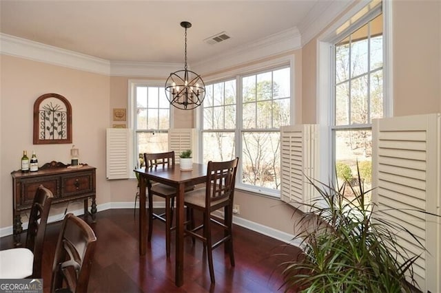 dining area with ornamental molding, dark hardwood / wood-style floors, and a wealth of natural light