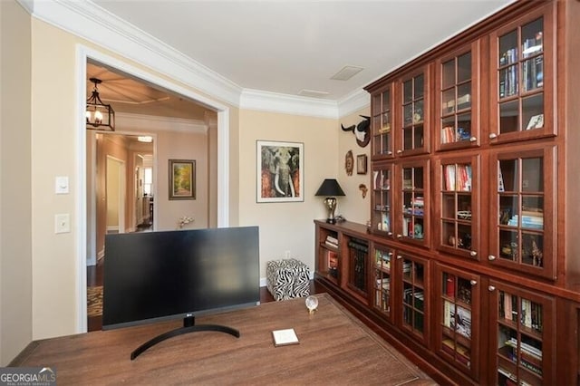 office featuring crown molding and a chandelier