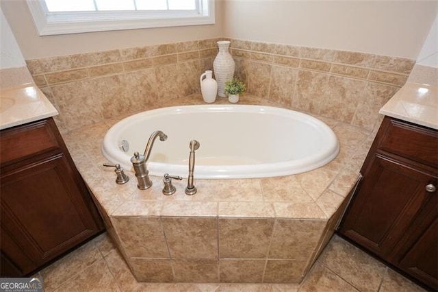 bathroom with vanity and a relaxing tiled tub