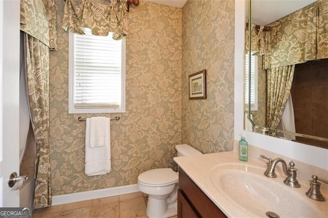 bathroom with vanity and toilet