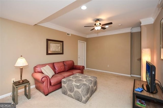 carpeted living room featuring crown molding and ceiling fan