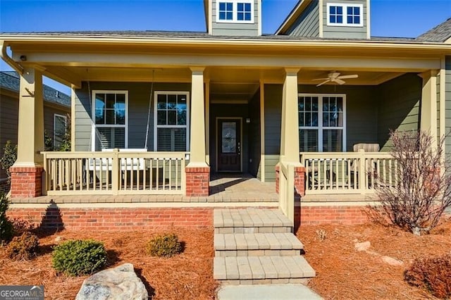 property entrance featuring ceiling fan and a porch