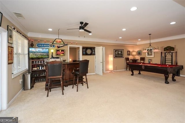 recreation room featuring bar, pool table, light carpet, ornamental molding, and ceiling fan