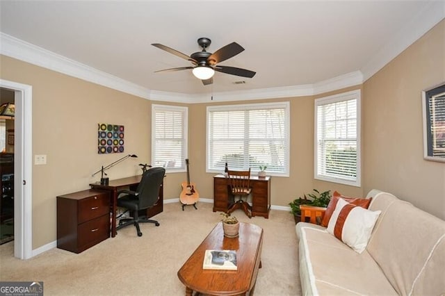 carpeted office featuring ornamental molding, a healthy amount of sunlight, and ceiling fan