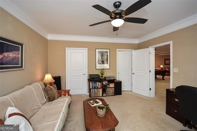 living room with crown molding, ceiling fan, and light carpet