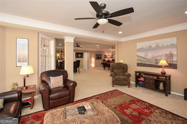 interior space with ornamental molding, ceiling fan, and ornate columns