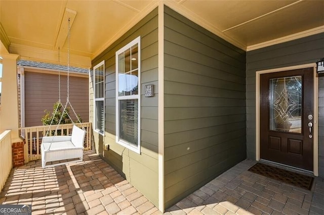 doorway to property with covered porch