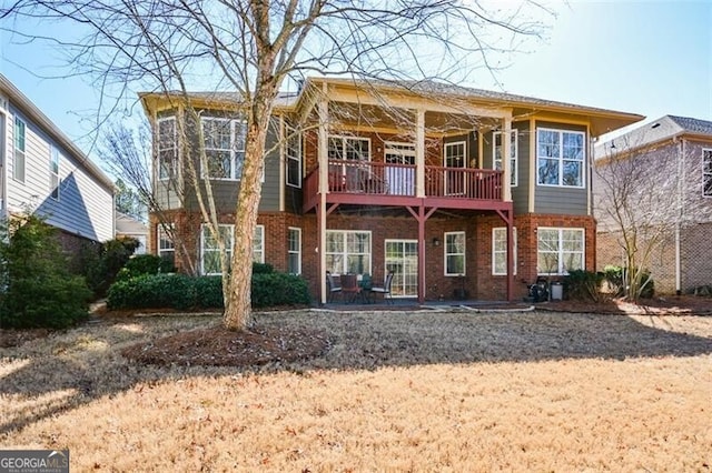 rear view of property featuring a patio