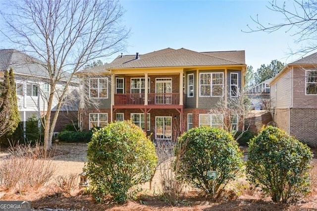 rear view of property with a balcony