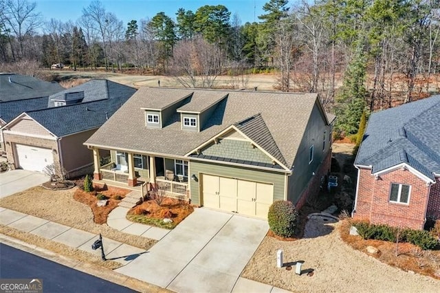 view of front of house featuring a garage and covered porch