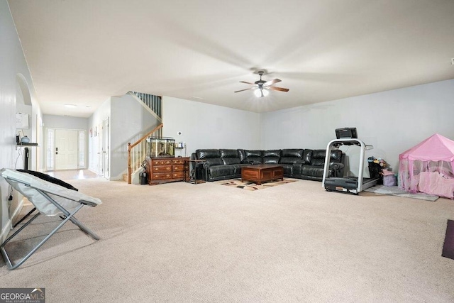 living room with carpet floors and ceiling fan