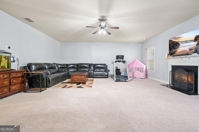 carpeted living room featuring ceiling fan