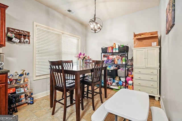 dining area with a notable chandelier