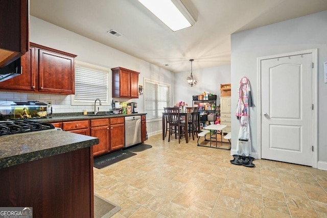 kitchen with sink, tasteful backsplash, an inviting chandelier, hanging light fixtures, and dishwasher