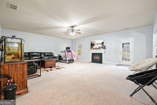 living room featuring light carpet and ceiling fan