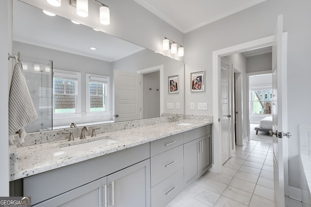 bathroom featuring ornamental molding and vanity