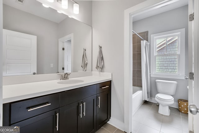 full bathroom with shower / bathtub combination with curtain, vanity, toilet, and tile patterned flooring