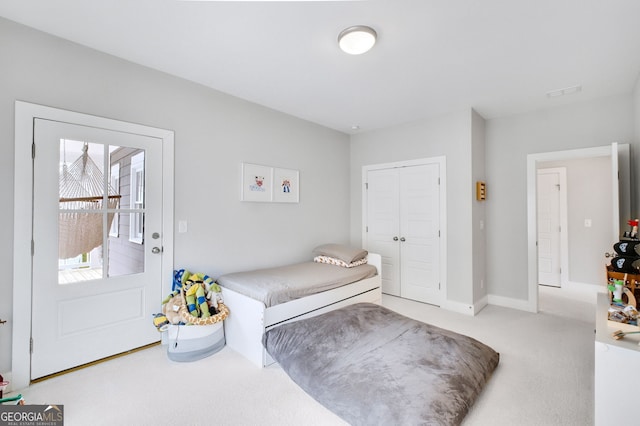 carpeted bedroom featuring a closet