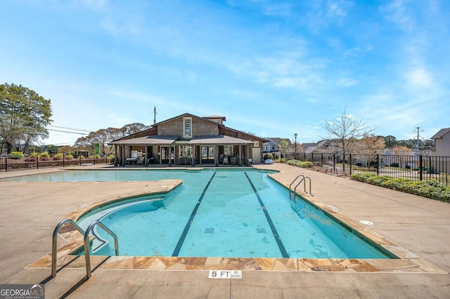 view of swimming pool featuring a patio area