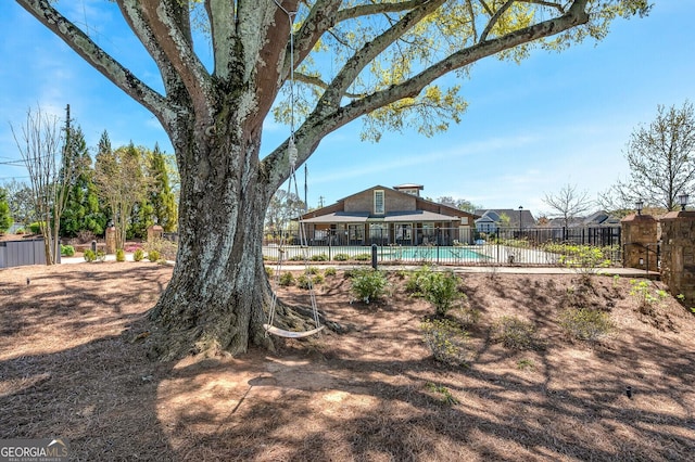 view of yard with a fenced in pool