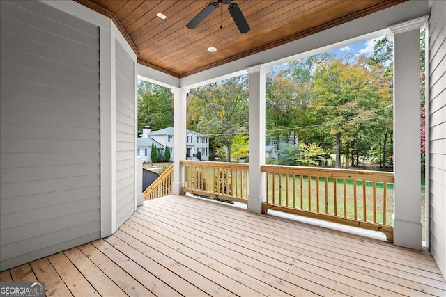 wooden deck featuring ceiling fan