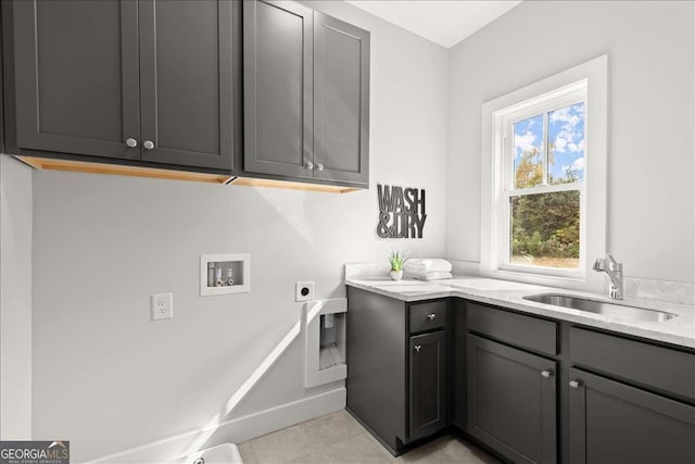 laundry room with cabinets, hookup for an electric dryer, sink, and washer hookup