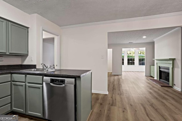 kitchen with sink, crown molding, dark wood-type flooring, stainless steel dishwasher, and kitchen peninsula