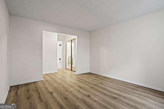 unfurnished room with light hardwood / wood-style flooring