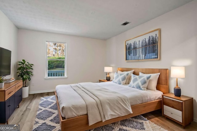 bedroom with light hardwood / wood-style flooring