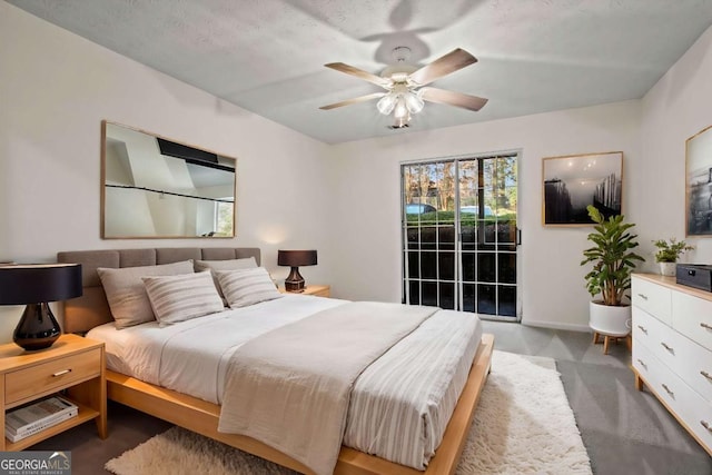 carpeted bedroom with access to outside and ceiling fan