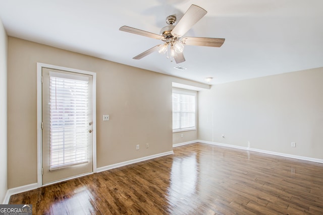 unfurnished room with wood-type flooring and ceiling fan