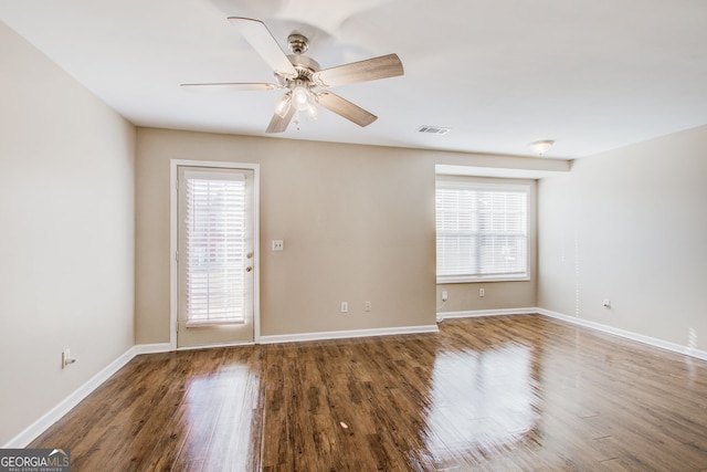 empty room featuring ceiling fan and hardwood / wood-style floors