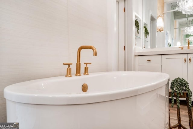 bathroom with sink and a tub