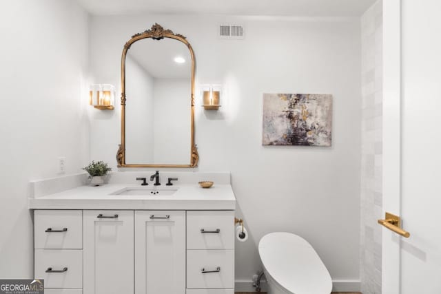 bathroom with vanity and toilet