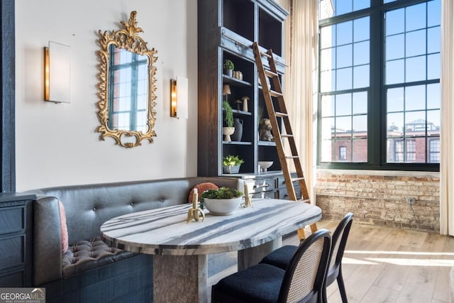 dining area with hardwood / wood-style flooring, a healthy amount of sunlight, and breakfast area