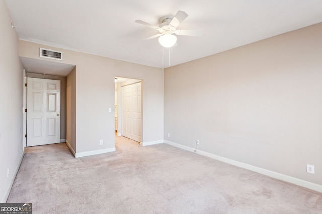 unfurnished bedroom featuring light carpet and ceiling fan