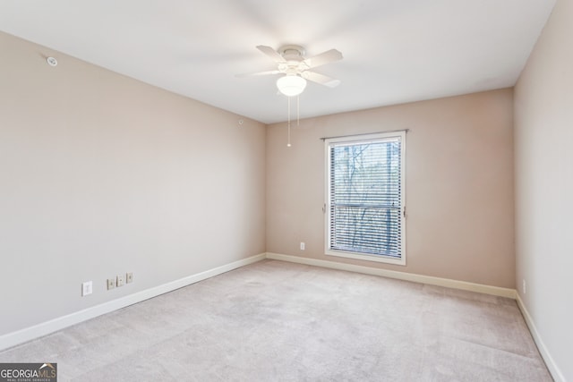 carpeted empty room with ceiling fan