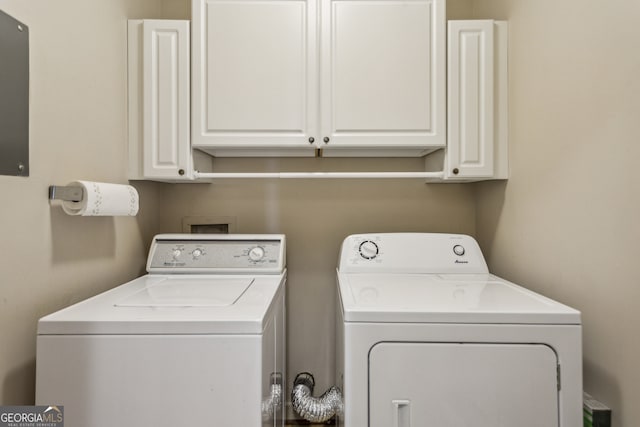 laundry room featuring cabinets and independent washer and dryer