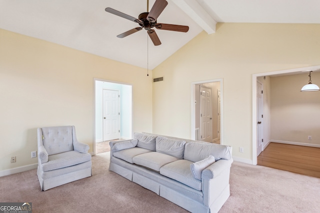 living room featuring beamed ceiling, high vaulted ceiling, light carpet, and ceiling fan