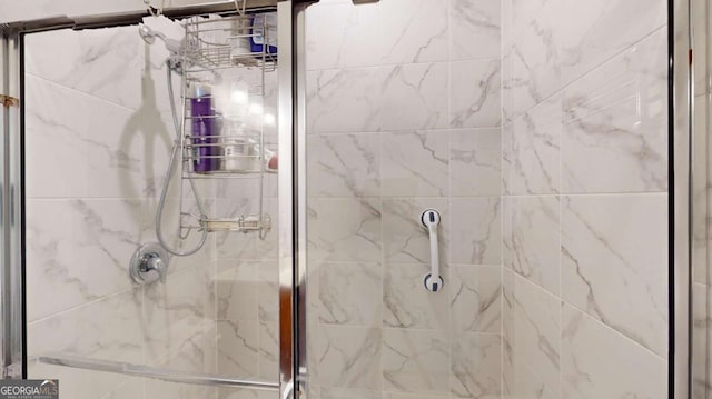 bathroom featuring a shower stall