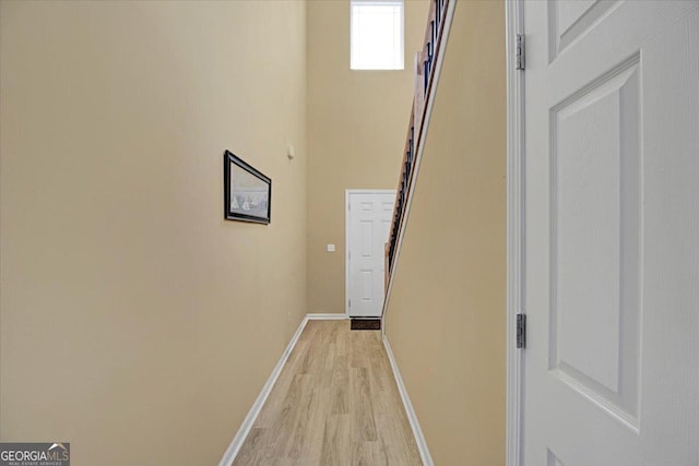 hall with light hardwood / wood-style flooring