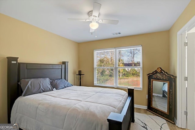 bedroom featuring ceiling fan and light hardwood / wood-style floors