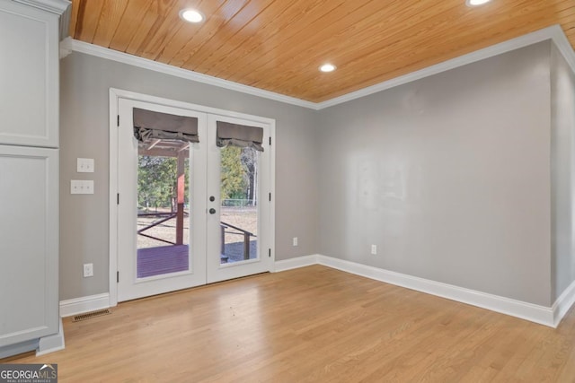 spare room featuring crown molding, wooden ceiling, light wood-type flooring, and french doors