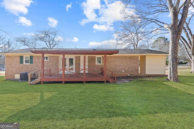 back of property featuring central AC, a deck, and a lawn