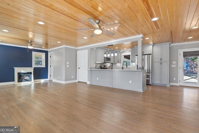 300 Oak Way, Eatonton, GA 31024 - unfurnished living room featuring wood ceiling, a ceiling fan, a fireplace, crown molding, and wood finished floors