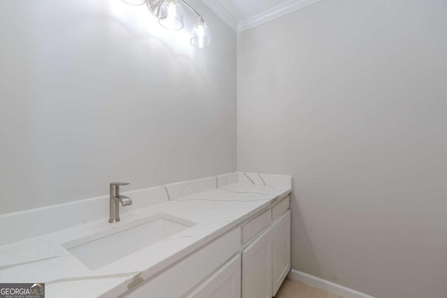 bathroom with vanity and ornamental molding