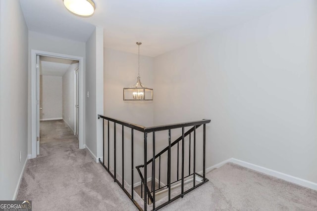 interior space with carpet flooring and a notable chandelier