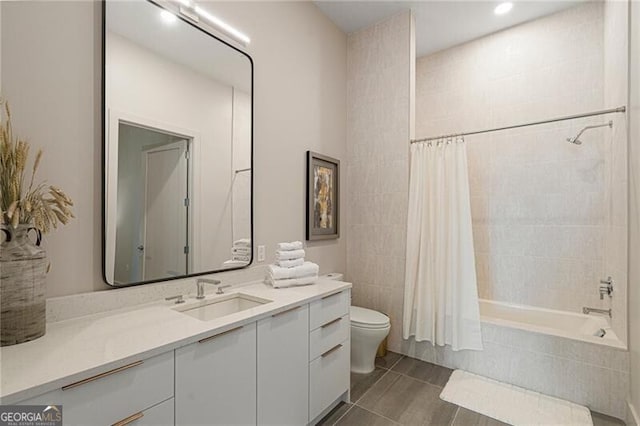 full bathroom featuring shower / bathtub combination with curtain, vanity, tile patterned floors, and toilet