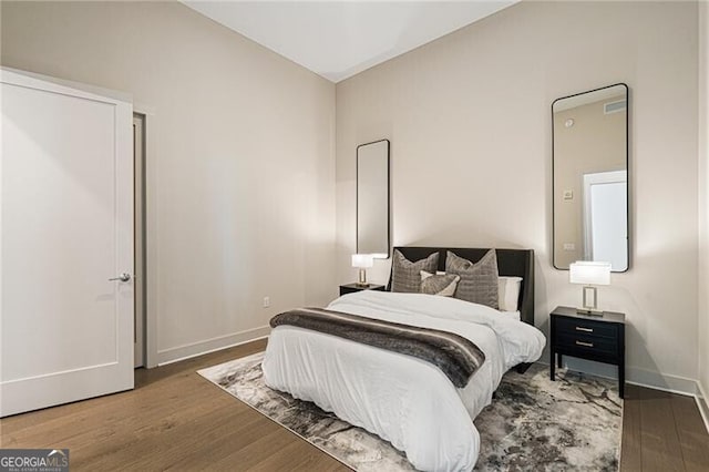 bedroom featuring dark hardwood / wood-style flooring