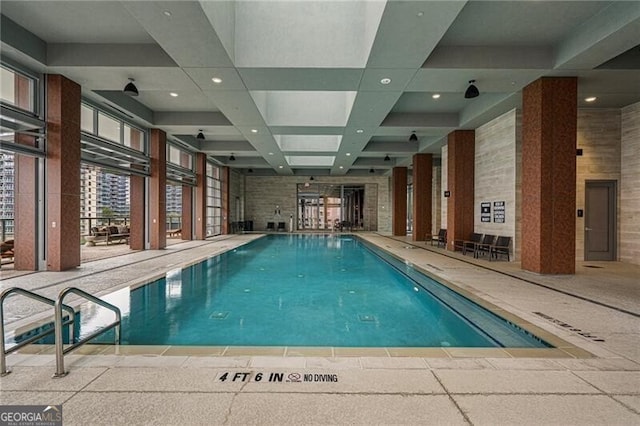 view of swimming pool with elevator